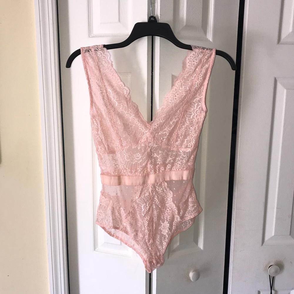 Laced body suit